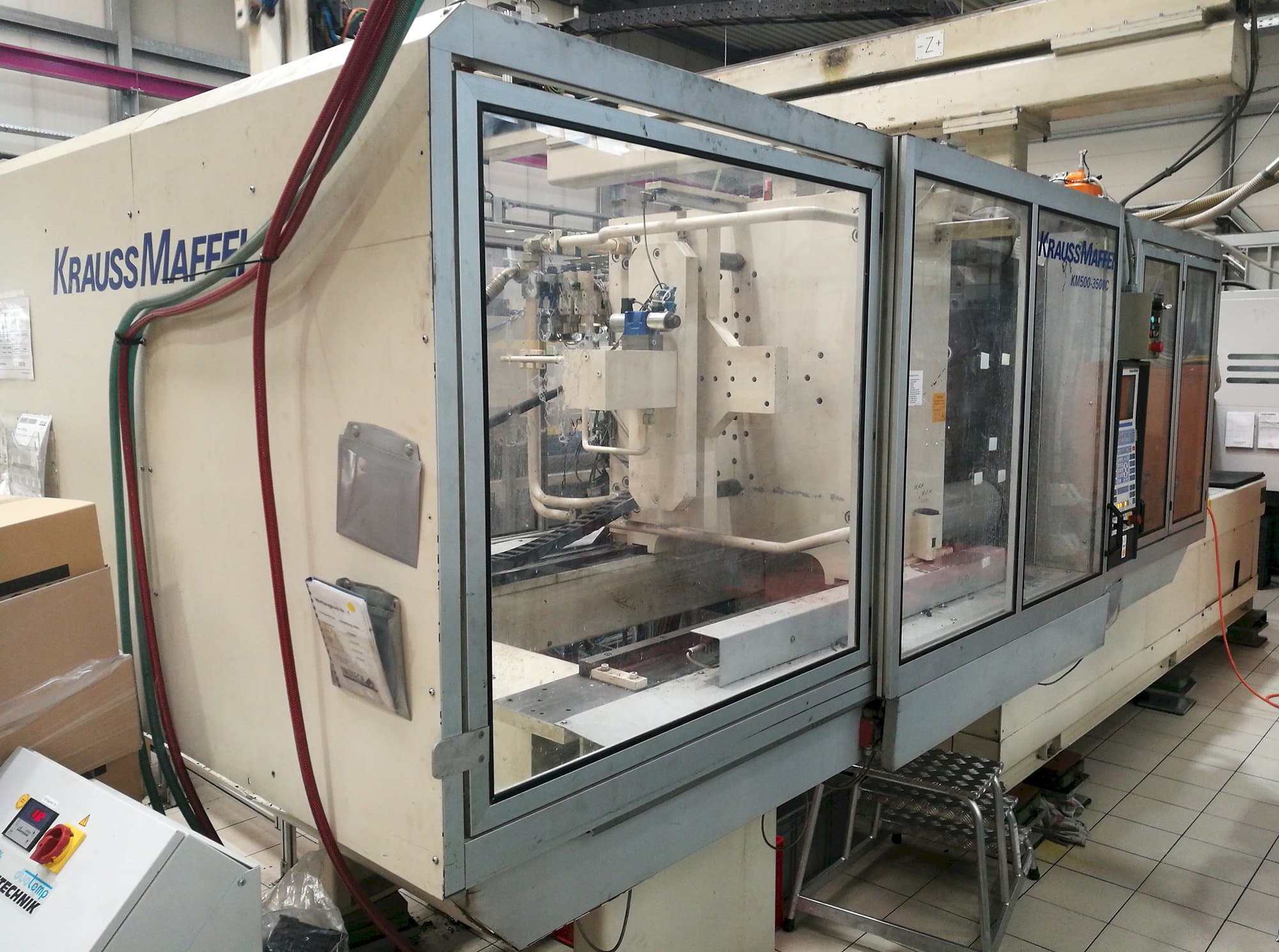 Krauss Maffei Mašinos kairės pusės vaizdasKM 500-3500 C1